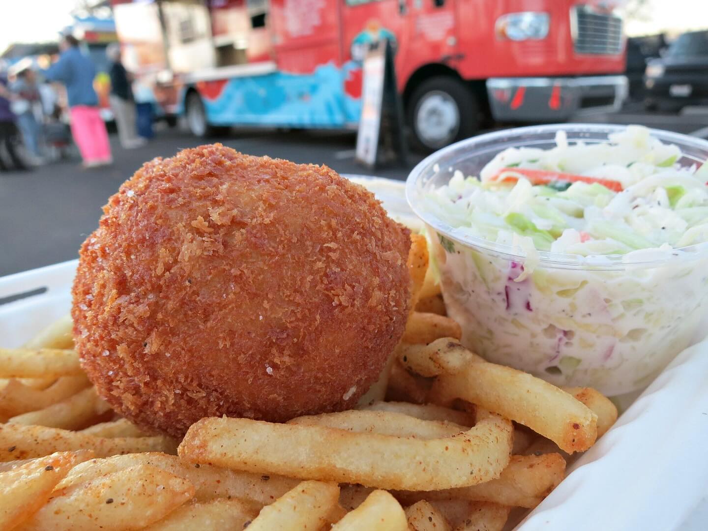 Crispy Crab Cake with Old Bay Fries and Coleslaw with Sam's ChowderMobile in background